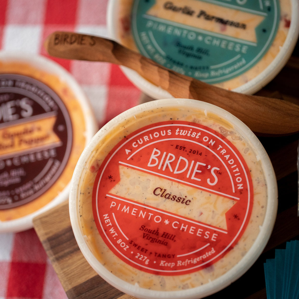 Birdie's Classic pimento cheese on a picnic board with Garlic Parmesan and Smoked Gouda