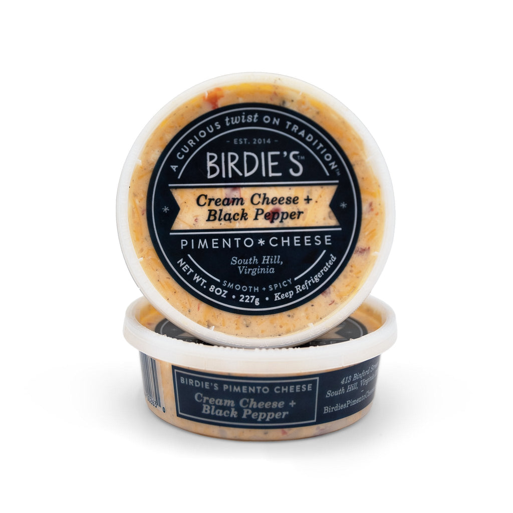 Two 8 oz tubs of Birdie's Cream Cheese + Black Pepper pimento cheese