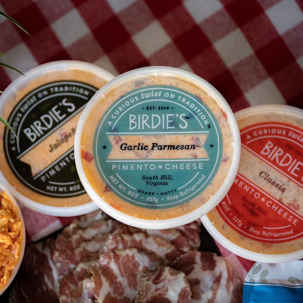 Birdie's Garlic Parmesan pimento cheese on a charcuterie spread with Jalapeño and Classic