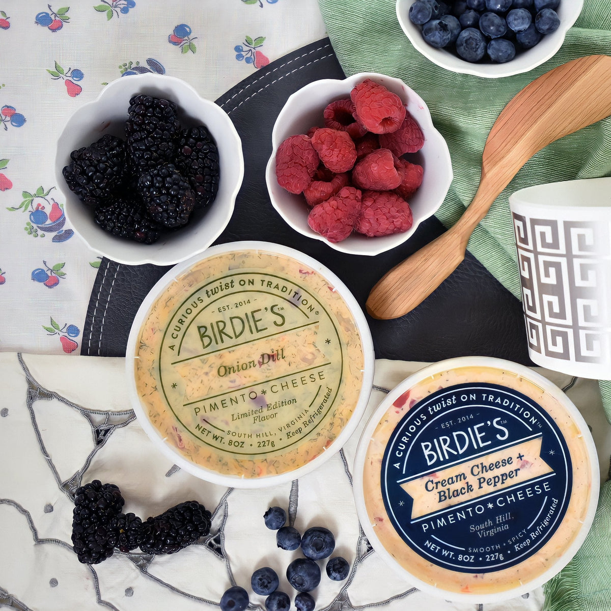 Birdie's Onion Dill pimento cheese with Cream Cheese + Black Pepper and bowls of berries