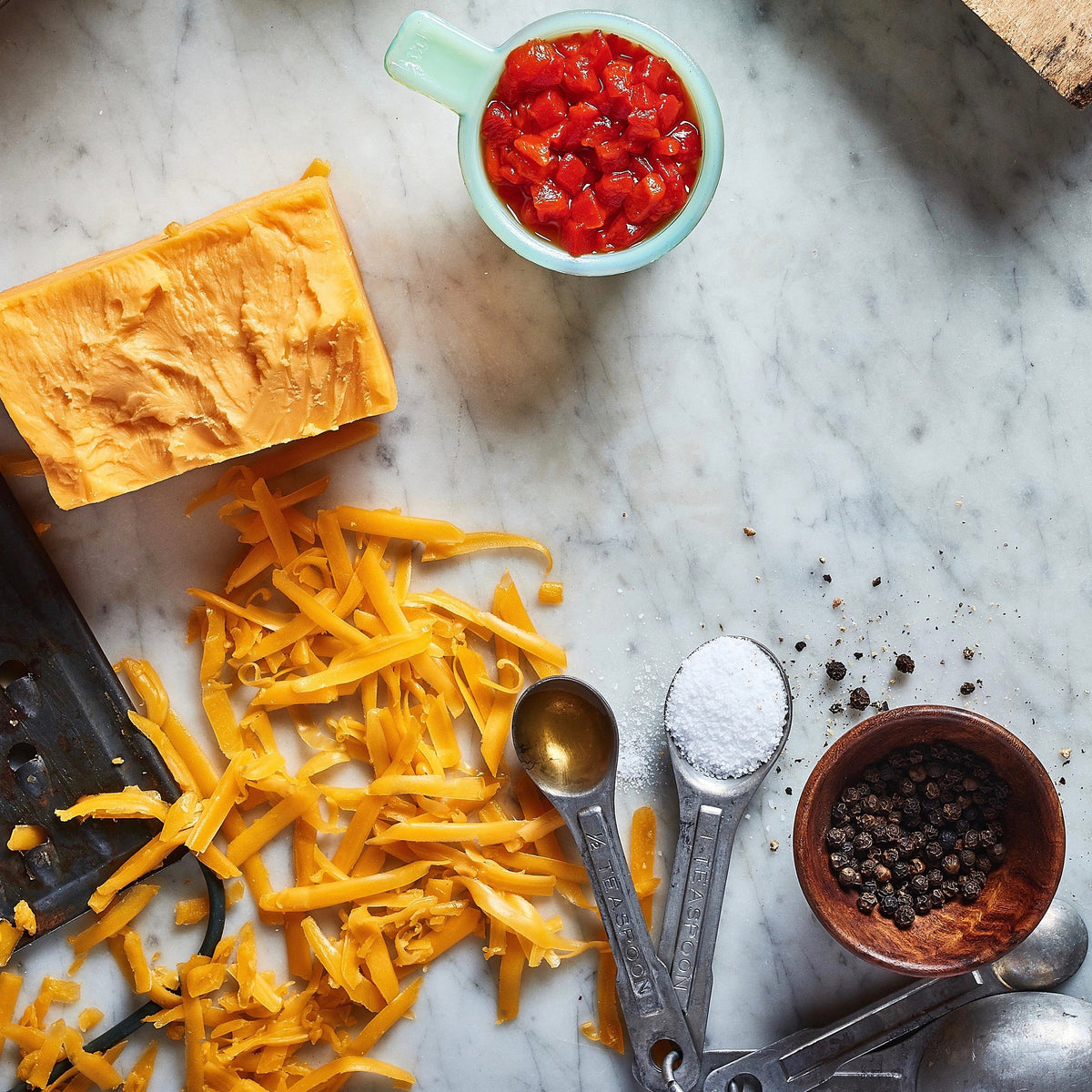 Grated cheddar, diced pimentos, salt and peppercorns: the makings of Birdie's Classic pimento cheese
