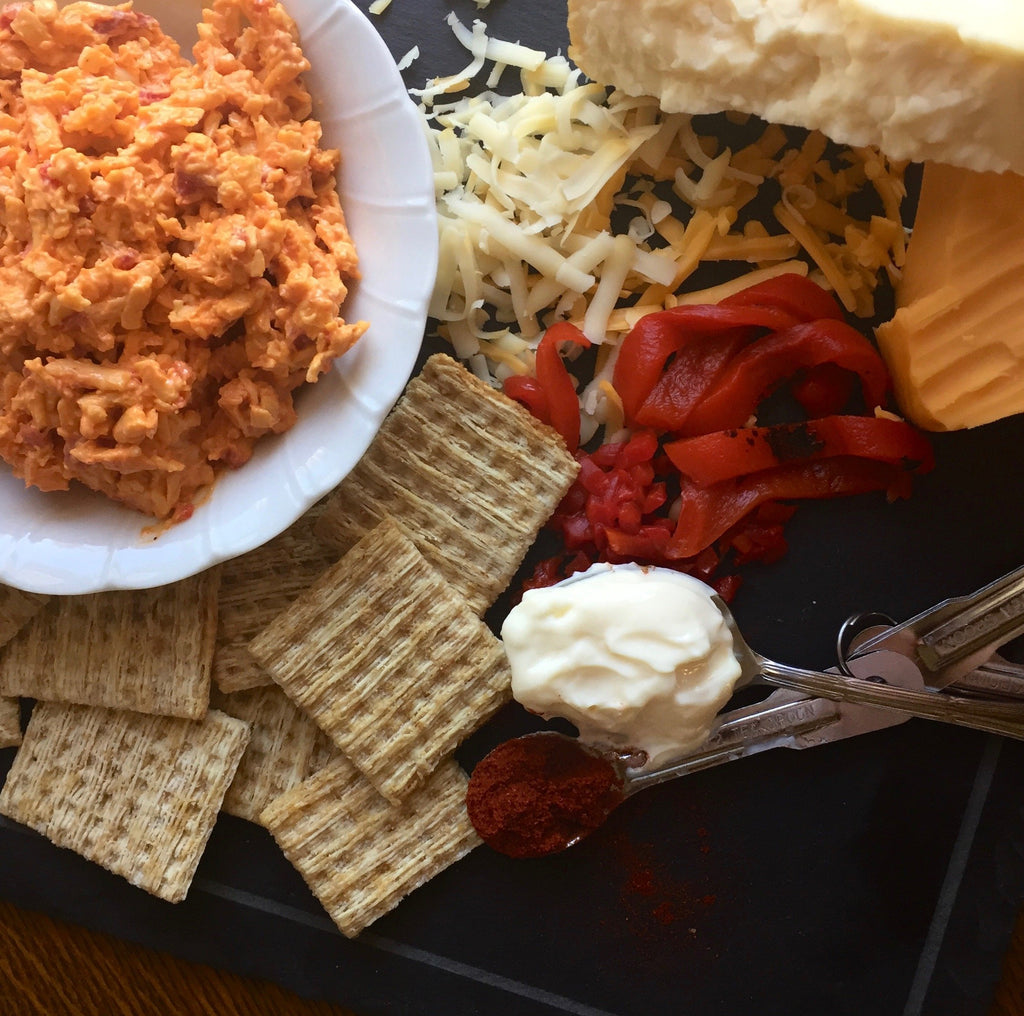 Birdie's Smoked Gouda + Roasted Red Pepper pimento cheese with crackers, roasted red peppers and shredded cheese