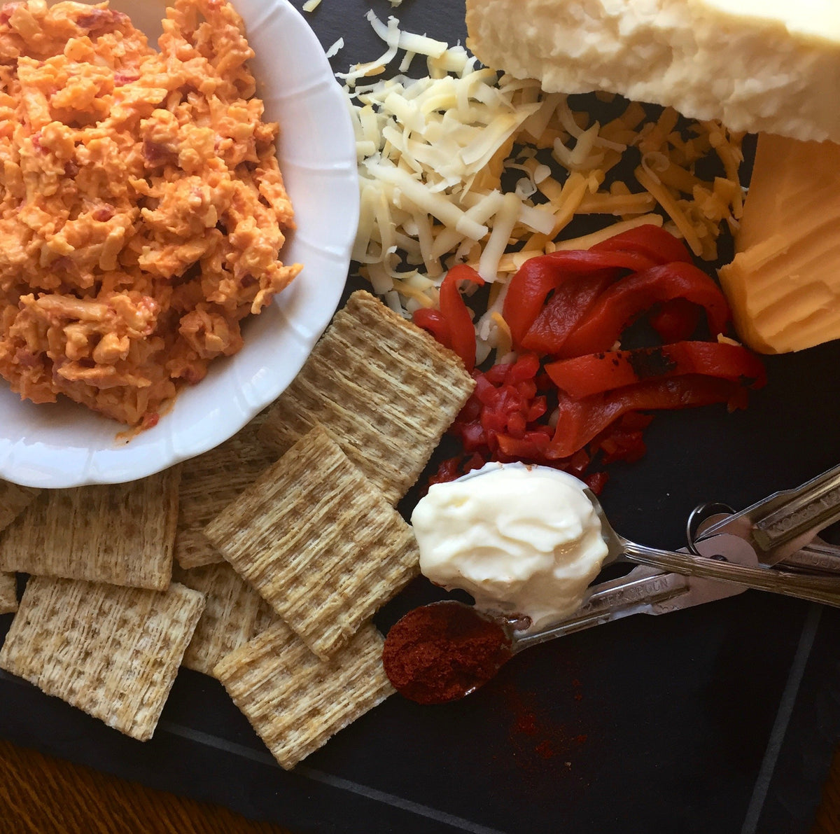 Birdie's Smoked Gouda + Roasted Red Pepper pimento cheese with crackers, roasted red peppers and shredded cheese
